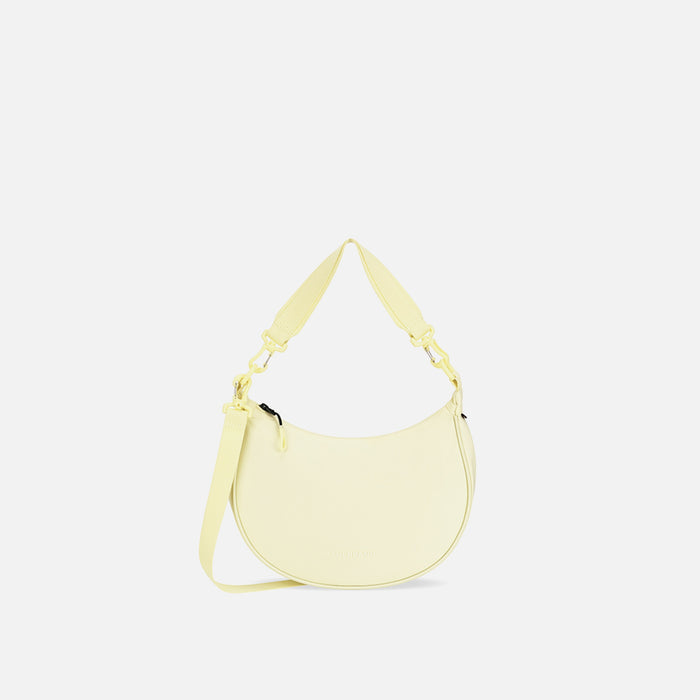 A Sherpani Mina Sol Yellow Medium Crossbody Bag, front view showing strap options on white background.  #color_sol-yellow