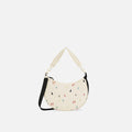 A Sherpani Mina Terrazzo Print Medium Crossbody Bag, front view showing strap options on white background.  #color_terrazzo-print