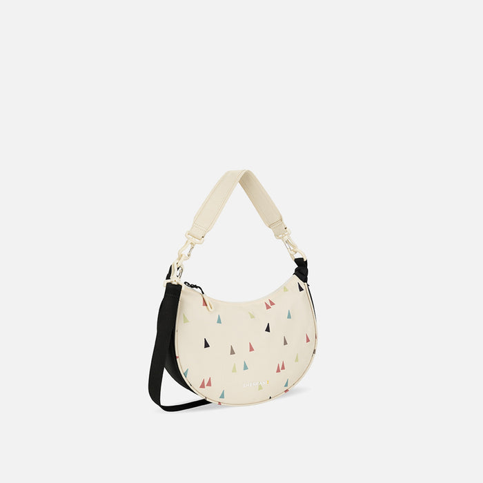 A Sherpani Mina Terrazzo Print Medium Crossbody Bag, 3/4 view showing strap options on white background. #color_terrazzo-print