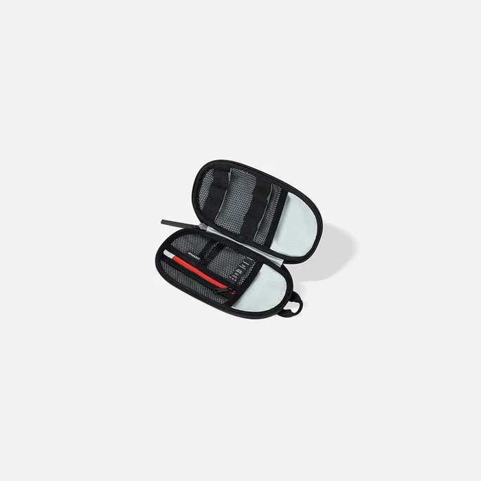 A Sherpani Mini Co-Pilot Carbon Black Mini Travel Organizer, above view showing inside of main pocket on white backdrop.  #color_carbon-black