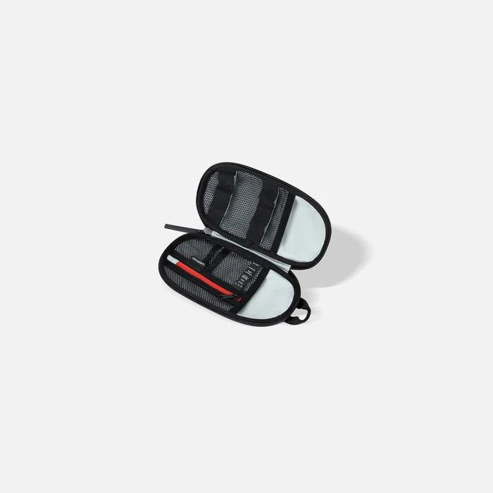 A Sherpani Mini Co-Pilot Granite Mini Travel Organizer, above view showing inside of main pocket on white backdrop.  #color_granite-grey