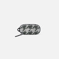 A Sherpani Mini Co-Pilot Houndstooth Mini Travel Organizer, front view showing side handle and main zipper against white background. #color_houndstooth-print