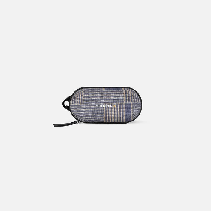 A Sherpani Mini Co-Pilot Passport Mini Travel Organizer, front view showing side handle and main zipper against white background. #color_passport-print