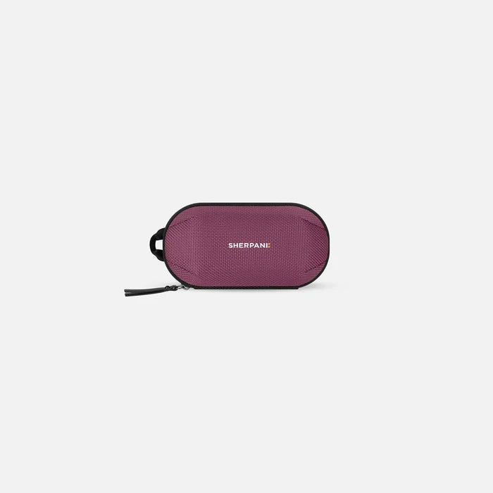 A Sherpani Mini Co-Pilot Smoky Orchid Mini Travel Organizer, front view showing side handle and main zipper against white background #color_smoky-orchid-pink