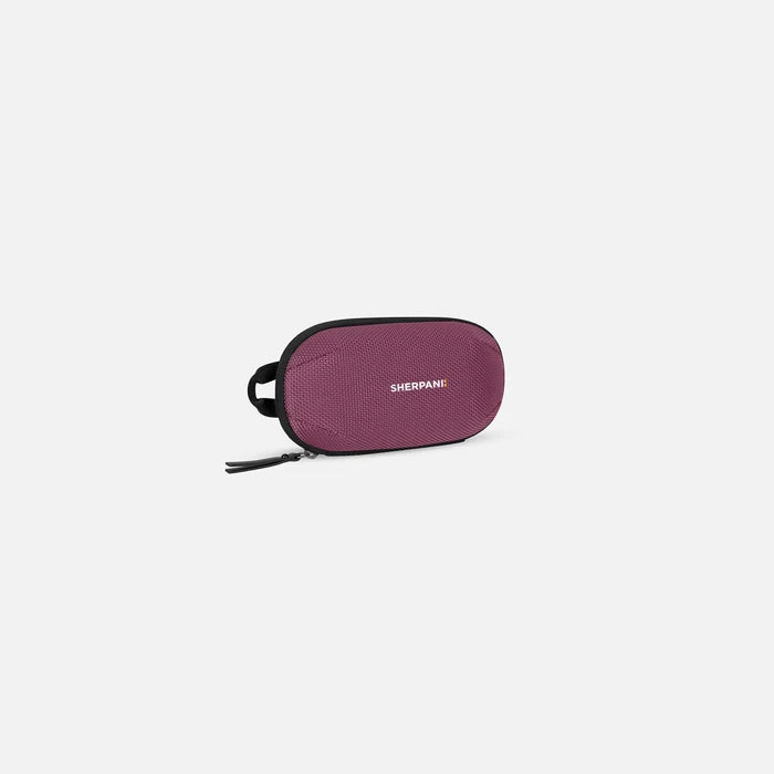 A Sherpani Mini Co-Pilot Smoky Orchid Mini Travel Organizer, 3/4 view showing main zipper and side handle on white background. #color_smoky-orchid-pink