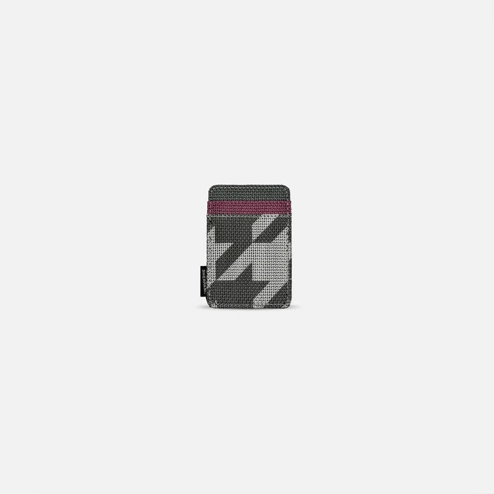 A Sherpani Porter Houndstooth Credit Card Sleeve Wallet, front view showing card holders against a white background. #color_houndstooth-print
