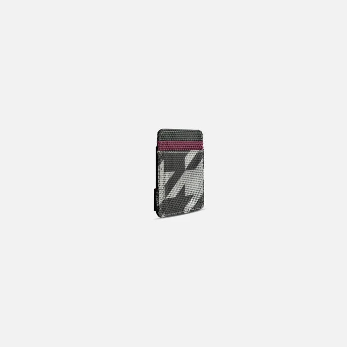 A Sherpani Porter Houndstooth Credit Card Sleeve Wallet, 3/4 view against a white background. #color_houndstooth-print