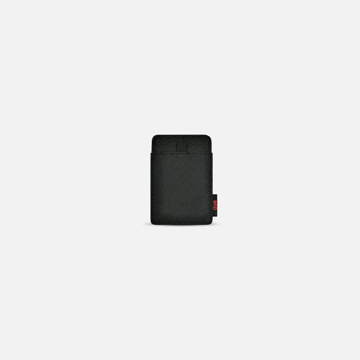A Sherpani Porter Houndstooth Credit Card Sleeve Wallet, back view against a white background. #color_houndstooth-print