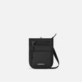 A Sherpani Prima Carbon Black Anti-theft Travel Crossbody, front view showing lockable pocket and strap on white background. #color_carbon-black