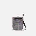 A Sherpani Prima Passport Anti-theft Travel Crossbody, front view showing lockable pocket and strap on white background. #color_passport-print