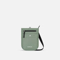 A Sherpani Prima Aloe Mist Green Anti-theft Travel Crossbody, front view showing lockable pocket and strap on white background. #color_aloe-mist-green