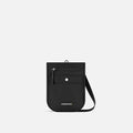 A Sherpani Prima Carbon Black Anti-theft Travel Crossbody, front view showing lockable pocket and strap on a white background. #color_carbon-black