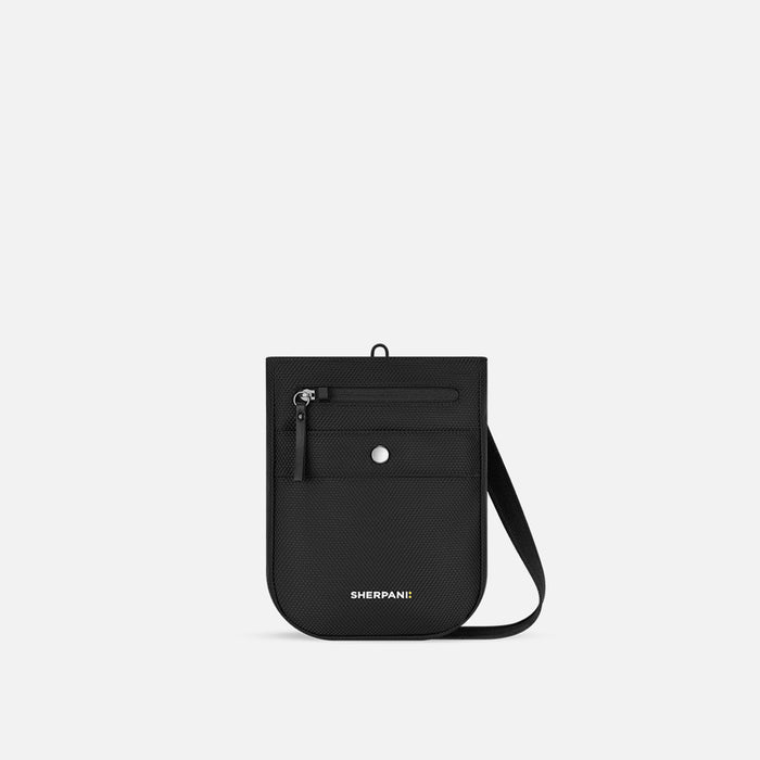 A Sherpani Prima Carbon Black Anti-theft Travel Crossbody, front view showing lockable pocket and strap on a white background. #color_carbon-black