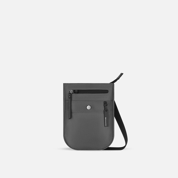 A Sherpani Prima Granite Travel Crossbody, front view showing lockable pocket and strap against white background. #color_granite