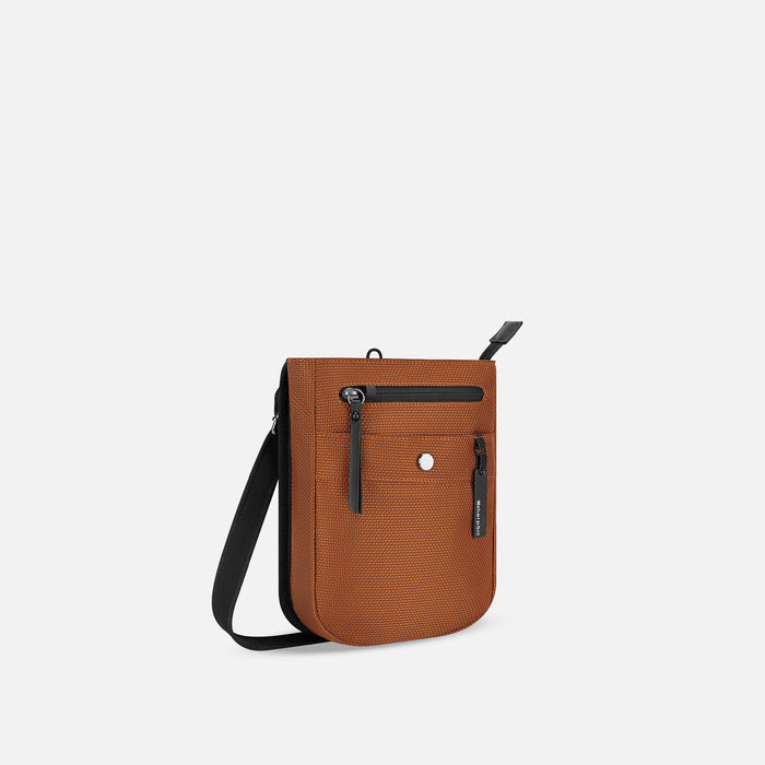 A Sherpani Prima Morocco Travel Crossbody, 3/4 view showing lockable pocket and strap against white background. #color_morocco