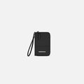 A Sherpani Rio Black Passport Wallet, front view showing wrist strap on white backdrop.  #color_black