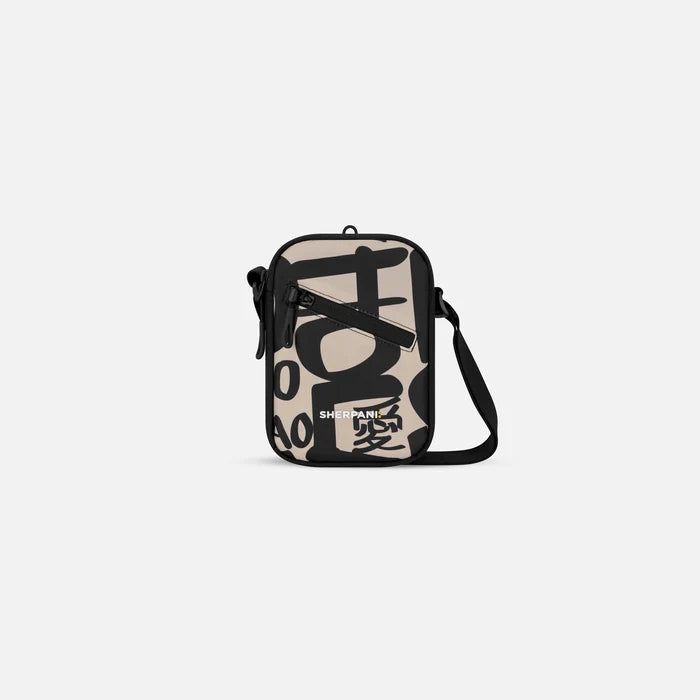 A Sherpani Rogue Ciao Mini Crossbody, front view showing adjustable strap and main zipper pocket on white background.  #color_ciao-print