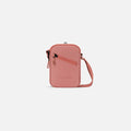 A Sherpani Rogue Desert Pink Mini Crossbody, front view showing adjustable strap and main zipper pocket on white background.  #color_desert-pink