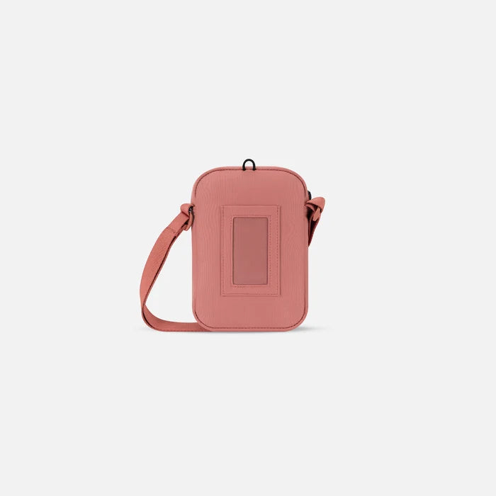 Sherpani Rogue Desert Pink Mini Crossbody, back view showing back pocket on white background.    #color_desert-pink