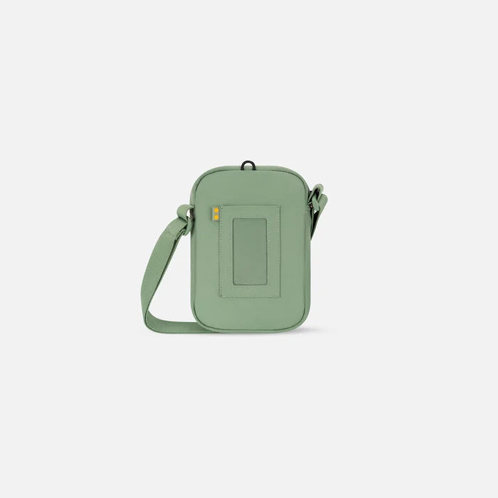 Sherpani Rogue Olivine Green Mini Crossbody, back view showing back pocket on white background.   #color_olivine-green