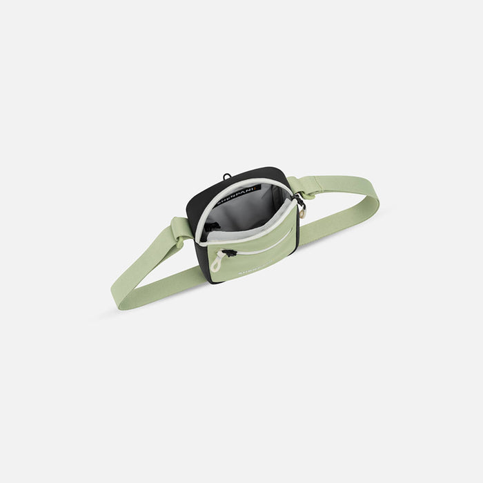 Sherpani Rogue Palm Green Mini Crossbody, above view showing inside of main zipper pocket on white background. #color_palm-green