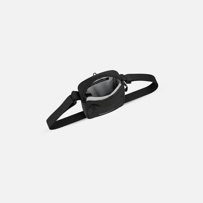 Sherpani Rogue Raven Black Mini Crossbody, above view showing inside of main zipper pocket on white background.  #color_raven-black