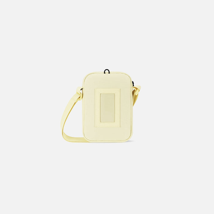 Sherpani Rogue Sol Yellow Mini Crossbody, back view showing back pocket on white background.  #color_sol-yellow