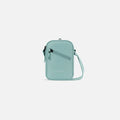 A Sherpani Rogue Surf Blue Mini Crossbody, front view showing lockable pocket & strap on white backdrop.  #color_surf-blue