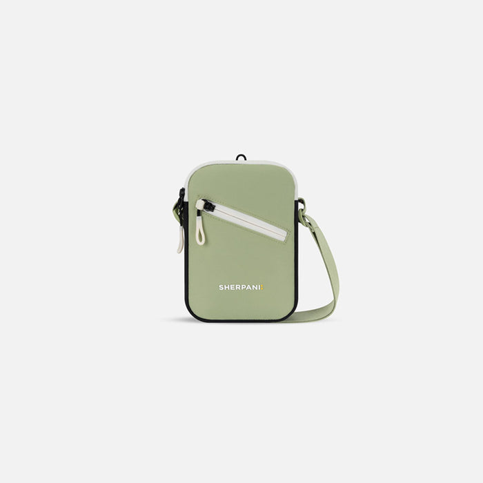 A Sherpani Rogue Palm Green Mini Crossbody, front view showing lockable pocket & strap on white backdrop. #color_palm-green