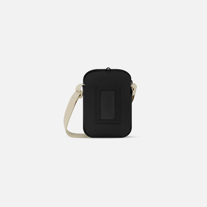 Sherpani Rogue Terrazzo Print Mini Crossbody, back view showing back pocket on white background.  #color_terrazzo-print