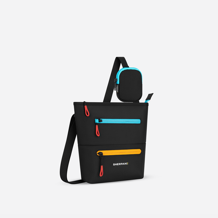 A Sherpani Chromatic Black Crossbody Bag, 3/4 view showing front lockable zipper pockets and the pouch attached to the strap. #color_chromatic-black