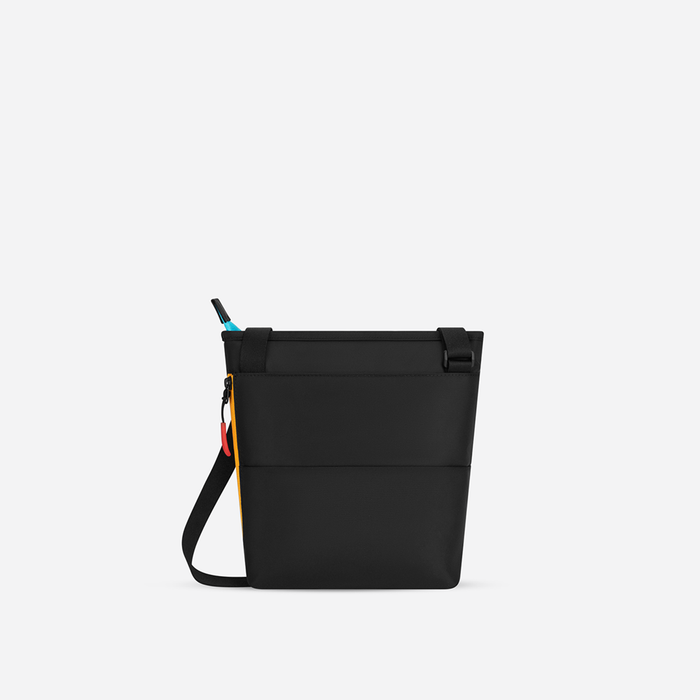 A Sherpani Sadie Chromatic Black Crossbody Bag, back view showing the side pocket.  #color_chromatic-black