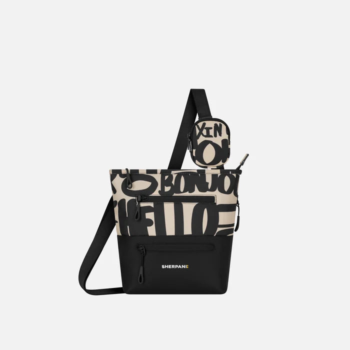 A Sherpani Sadie Ciao Crossbody Bag, front view showing pouch attached to strap and front lockable zipper pockets. #color_ciao-print