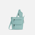 A Sherpani Sadie Surf Blue Crossbody Bag, front view showing pouch attached to strap and front lockable zipper pockets. #color_surf-blue