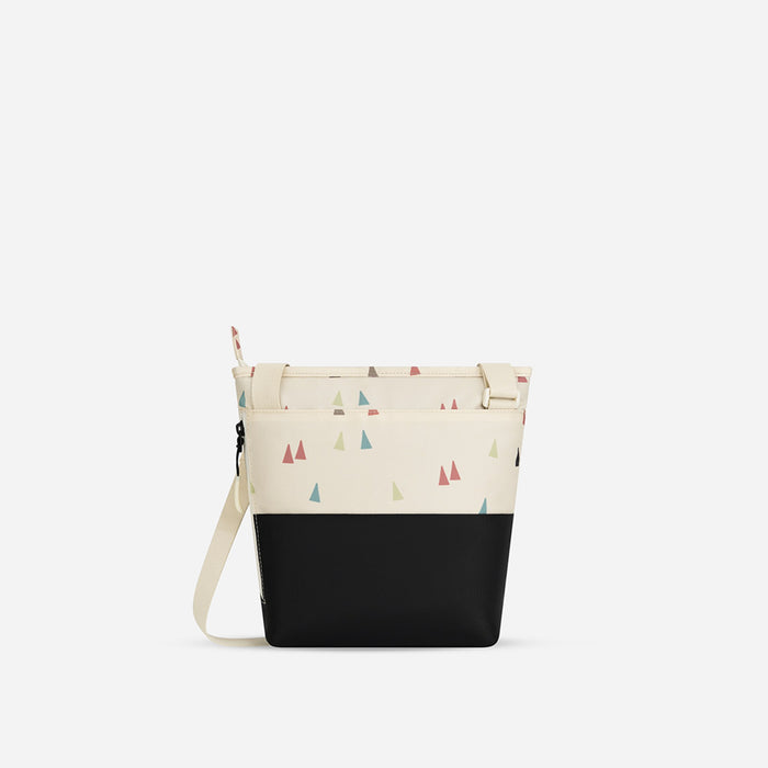 A Sherpani Sadie Terrazzo Print Crossbody Bag, back view showing side pocket against white backdrop.  #color_terrazzo-print