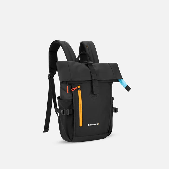 A Sherpani Sedona Chromatic Black Backpack, 3/4 view showing buckled pockets and straps on white background.  #color_chromatic-black