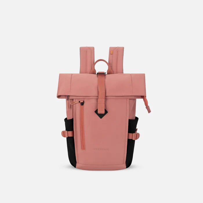 A Sherpani Sedona Desert Pink Backpack, front view showing buckled pockets and straps on white backdrop. #color_desert-pink