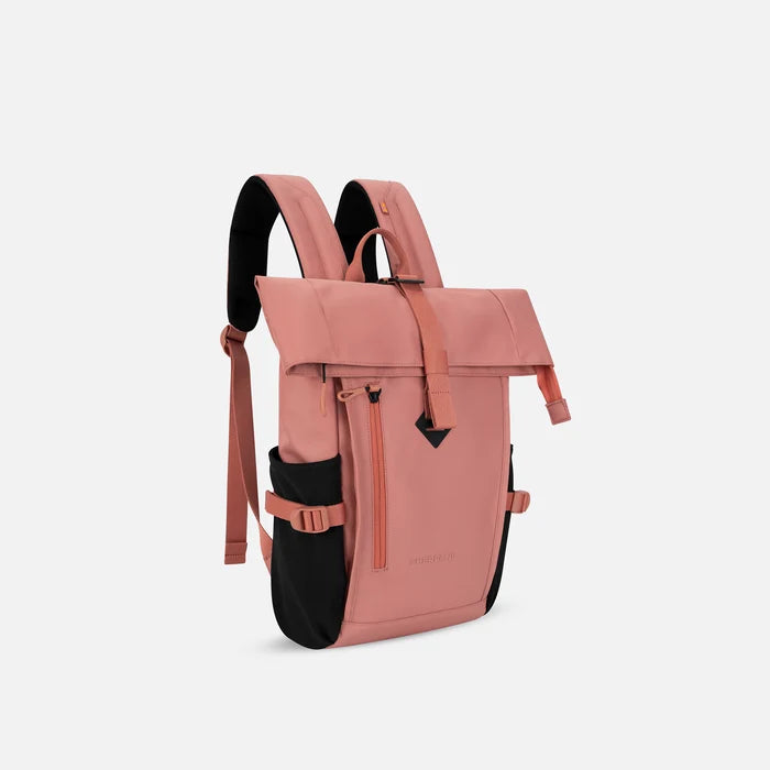 A Sherpani Sedona Desert Pink Backpack, 3/4 view showing buckled pockets and straps on white background.   #color_desert-pink