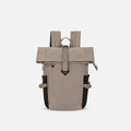 A Sherpani Sedona Dune Backpack, front view showing buckled pockets and straps on white backdrop. #color_dune-tan