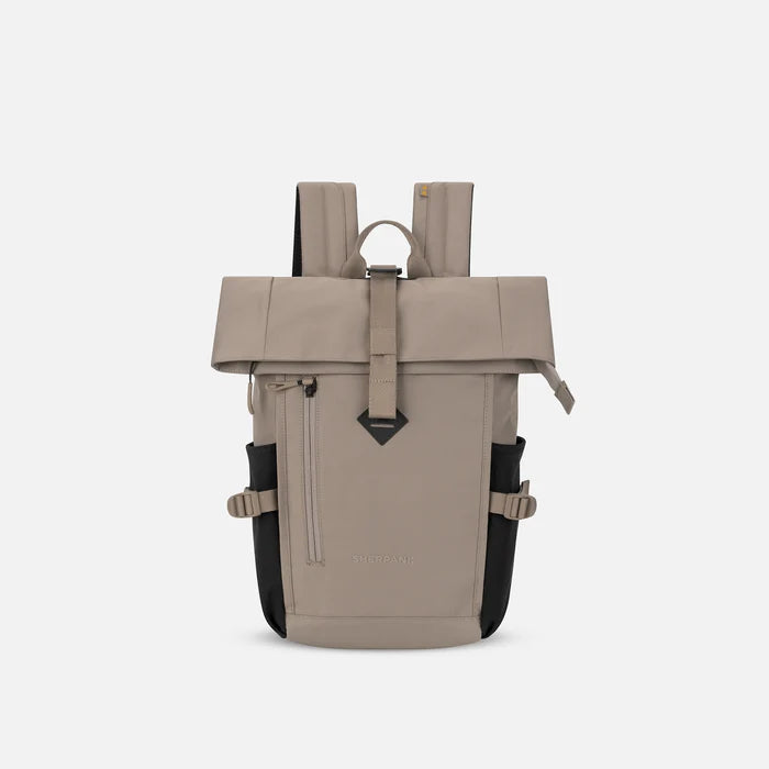 A Sherpani Sedona Dune Backpack, front view showing buckled pockets and straps on white backdrop. #color_dune-tan