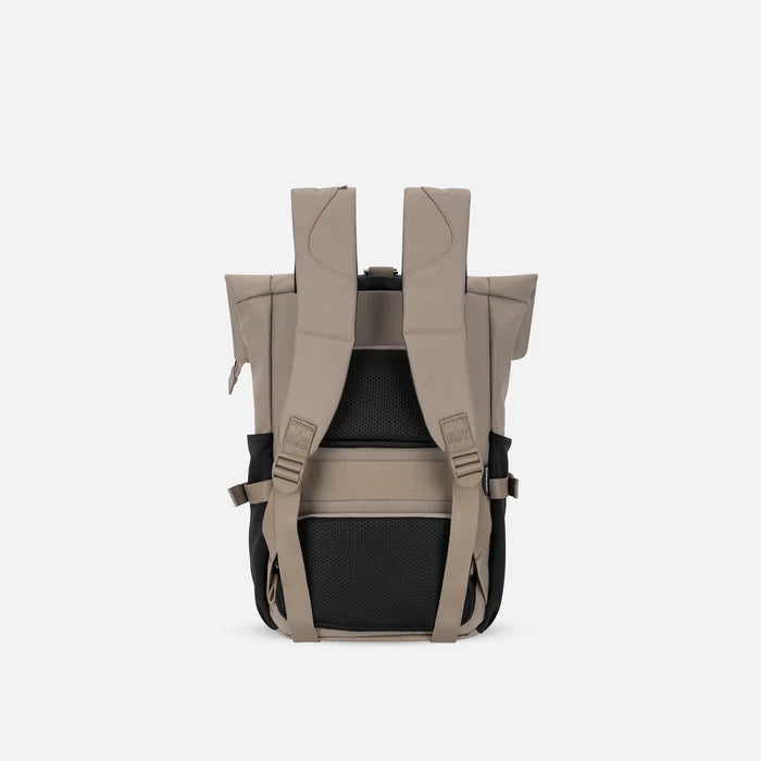 A Sherpani Sedona Dune Backpack, back view showing shoulder straps and luggage strap on white background. #color_dune-tan