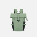 A Sherpani Sedona Olivine Backpack, front view showing buckled pockets and straps on white backdrop. #color_olivine-green