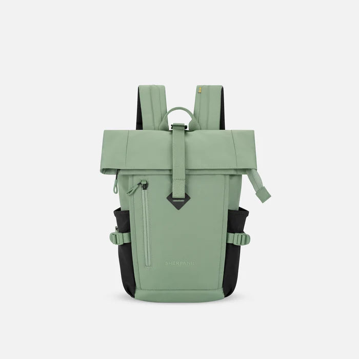 A Sherpani Sedona Olivine Backpack, front view showing buckled pockets and straps on white backdrop. #color_olivine-green