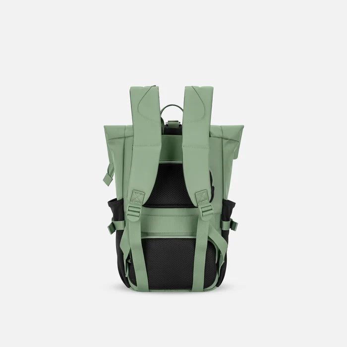 A Sherpani Sedona Olivine Backpack, back view showing shoulder straps and luggage strap on white background. #color_olivine-green