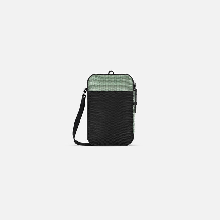 A Sherpani Simplicity Aloe Mist Green Anti-Theft Crossbody Wallet, back view showing back pocket on a white background.#color_aloe-mist-green