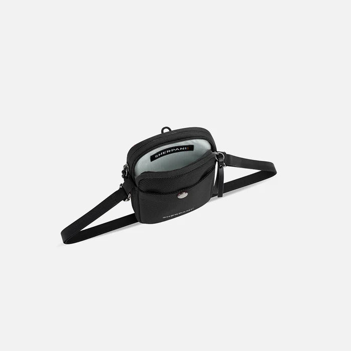 A Sherpani Simplicity Carbon Black Anti-Theft Crossbody Wallet, above view showing inside main pocket on a white background.  #color_carbon-black