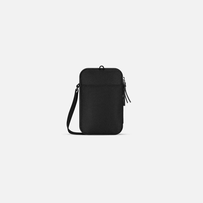 A Sherpani Simplicity Carbon Black Anti-Theft Crossbody Wallet back view showing back pocket against white background. #color_carbon-black
