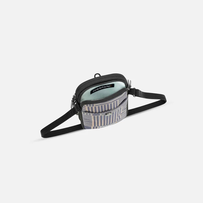 A Sherpani Simplicity Passport Anti-Theft Crossbody Wallet, above view showing inside main pocket on a white background.  #color_passport-print