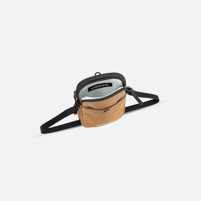 A Sherpani Simplicity Sand Anti-Theft Crossbody Wallet, above view showing inside main pocket on a white background.  #color_sand-tan
