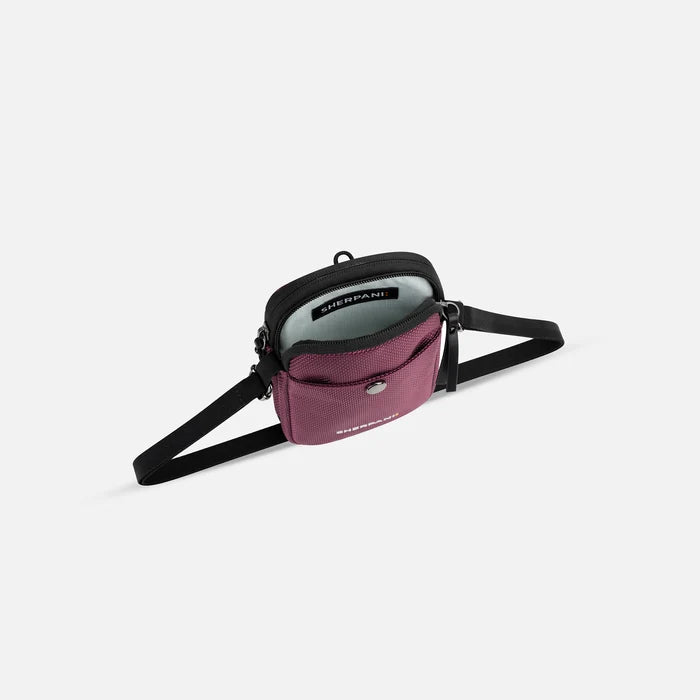A Sherpani Simplicity Smoky Orchid Anti-Theft Crossbody Wallet, above view showing inside main pocket on a white background.  #color_smoky-orchid-pink